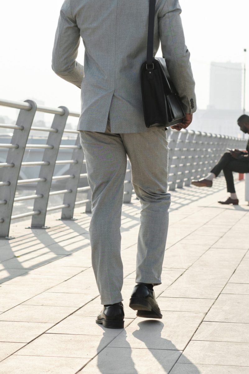 unrecognizable-businessman-walking-along-street-2023-11-27-05-16-45-utc-scaled.jpg